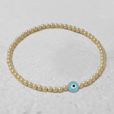 "* 3 mm Gold Filled (14/20) Beads * 7 mm Glass Evil Eye Beads (Light Blue, Black, Dark Blue, Clear, Green, Red) Available in Various Sizes. Please choose from drop down list. I make 6.5\" for most wrist size To determine your bracelet size: Measure with a tape around your wrist (where you would like the bracelet to sit). If you don't have access to a measuring tape, wrap a string around your wrist and measure the length with a ruler. This is your wrist size. To determine your bracelet size add 1 Affordable Adjustable Hand-strung Evil Eye Bracelet, Adjustable Hypoallergenic Gold Evil Eye Bracelet, Hypoallergenic Gold Evil Eye Bracelet, Glass Evil Eye, Evil Eye Beads, Turkish Evil Eye, Summer Bracelets, Protection Bracelet, Eye Bracelet