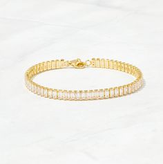 "Super chic bracelet, that is beautiful and minimalist. Adds a nice touch of sparkle, while still being classy! - - D E T A I L S - - ▪︎ We use a Thick plating of 14k Gold or Rhodium over Brass ▪︎ Available in 3 Sizes: 6.25\", 6.5\", or 6.75\" + 0.5\" Extension Chain ▪︎ 4.4mm wide ▪︎ Lobster Clasp Closure ▪︎ Nickel-free, lead free and hypoallergenic ▪︎ Highest Grade CZ for an authentic diamond look Made with 100% Pure Love ♡ Ships in a white gift box, ready for gift giving!" Being Classy, Tennis Bracelet Gold, Gold Tennis Bracelet, Custom Bling, Bracelet Diamond, Chic Bracelet, Bracelet Dainty, Dainty Bracelet, Celestial Jewelry