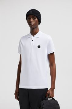 A timeless design that transcends seasons, this polo shirt is crafted from cotton piqué. The classic style is embellished with a Moncler logo patch on the chest. Luxury Cotton Short Sleeve Polo Shirt, Designer Cotton Polo Shirt, Designer Collared Cotton Polo Shirt, Luxury Fitted White Polo Shirt, Luxury Cotton Polo Shirt, Designer Cotton Tops With Ribbed Collar, Luxury Cotton Polo Collar Top, Luxury Cotton Top With Polo Collar, Designer Cotton Top With Polo Collar