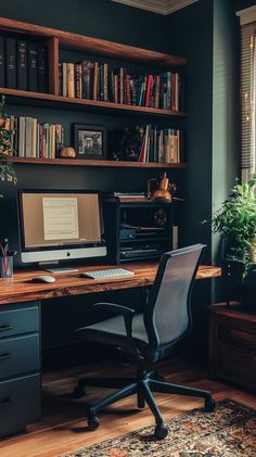 a desk with a computer on top of it in front of a bookshelf