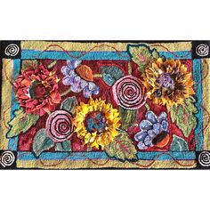 a close up of a rug with sunflowers and flowers on it's border