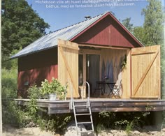 a small wooden cabin sitting on top of a river