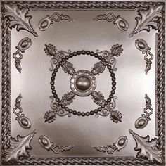 a metal plate with an ornate design on it