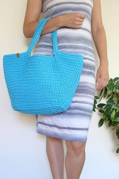 Boho chic, this crochet bag is irreplaceable during summer. This classic basket shape purse is ideal addition to flimsy dress or to short or long jeans, t-shirt and sweater. Either as a summer accessory, as a beach bag or everyday bag - it's comfortable in using. Roomy enough to fill it with books, beach stuff, kid's stuff or groceries. Perfect as a gift too! Casual Crochet Beach Bag, Beach Shoulder Bag In Cotton, Cotton Beach Bag For Summer, Spring Vacation Cotton Straw Bag, Casual Spring Cotton Straw Bag, Casual Crochet Straw Bag For Summer, Natural Cotton Crochet Bag For Summer, Summer Crochet Cotton Bag In Natural Color, Summer Cotton Bucket Shoulder Bag