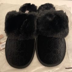 New Coach Slippers. Size 7b. Color Black. Black Winter Slippers With Round Toe, Black Cushioned Slippers For Winter, Black Closed Toe Winter Slippers, Black Flat Slippers For Winter, Black Flat Winter Slippers, Black Round Toe Slippers For Fall, Comfortable Black Slippers For Fall, Coach Slippers, Coach Slides