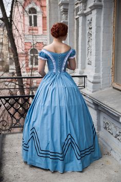 Blue cotton gown with contrasting velvet black trims is made after Hungarian fashion popular in 1860s Europe. It's the style Empress Sissi could wear during her Hungarian holidays. Such examples of military costume motifs were also popular during America Civil War in 1860s. The dress consists of the bodice and skirt. The skirt is one-layered, decorated with velvet trims. The bodice is boned and decorated with white laces and velvet trims as well. Please mind, the dress is sold without the hoopsk Queen Victoria Wedding Dress, Gone With The Wind Dresses, Victoria Wedding Dress, Little Women Costumes, Jane Austen Dress, Empress Sissi, Military Costumes, Cotton Gowns, Regency Dress