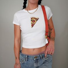 We love this fun, colorful Pizza design Baby Tee! This adult sized tee is soft and super comfy and is made of 52% cotton and 48% polyester for a luxurious lightweight stretch. The designs are printed with DTF which delivers a vivid, detailed design with a textured feel. This tee is a perfect blend of coquette fashion and nostalgic Y2K vibes, making it a trendy addition to your casual wardrobe. Made with soft, comfortable material, it's ideal for everyday wear or for making a statement at your ne Playful Cotton Shirt With Custom Print, Fitted Fun T-shirt With Screen Print, Playful Fitted Short Sleeve T-shirt, Fun Fitted Short Sleeve Tops, Fun Custom Print Tops For Streetwear, Fun Unisex Tops With Custom Print, Cute Fitted Cotton Shirt, Fun Unisex Custom Print Tops, Fitted Tops With Funny Print