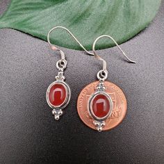 Visit our on-line shop at: Etsy.com/shop/AlbuquerqueDesigns *sterling silver earrings with stone *dangles / drops / hooks / earwires *southwestern jewelry *carnelian / healing carnelian *calibrated pre-cut stones: 9x7mm oval shape *back of jewelry items are all covered / do not show the back of stones *all jewelry items are made to ship, slight variations in stones will occur comparing to pictures. *size of a penny is 19mm or a dime is 18mm in diameter for comparing size with jewelry items. *han Silver Carnelian Earrings For Gift, Red Carnelian Earrings, Nickel-free Carnelian Jewelry, Silver Carnelian Earrings, Round Carnelian Earrings, Silver Carnelian Jewelry With Ear Wire, Carnelian Earrings, Carnelian Necklace, Southwestern Jewelry