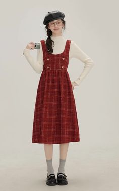 The sweetest little apple in town. This pinafore dress features a scoop neckline and thick shoulder straps for layering, heart buttons on the chest, cinched waist with a big bow behind, and a midi length skirt on a plaid tweed fabric. Opens easily with a concealed side zipper. S: 28" chest, 24.5" waist, 42.5" lengthM: 29.5" chest, 26" waist, 42.5" lengthL: 31" chest, 27.5" waist, 43" lengthXL: 32.5" chest, 29" waist, 43" length Pinafore Dress Outfit, Fall Dress Outfit, Midi Length Skirts, Tweed Fabric, Big Bow, Pinafore Dress, Overall Dress, Sweater Blouse, Cinched Waist