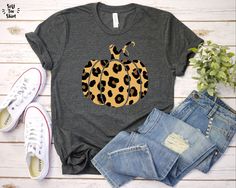 "Leopard Pumpkin, Leopard Pumpkin Shirt, Leopard Fall Shirt, Cheetah Pumpkin, Pumpkin Fall Shirt, Pumpkin Tshirt, Cheetah Pumpkin We use high-quality unisex Jersey Bella+Canvas 3001 Short Sleeve Tee. HOW TO ORDER? Please, check and review all photos; 👕 Choose your T-Shirt size and design color of the T-Shirt; 🛒 Click \"Add to cart\". You can go back to add more product; 💵 Click \"Proceed to checkout\" or \"Pay with PayPal\" (you can pay at PayPal without a PayPal account); 📦 Your order will Cheetah Pumpkin, Leopard Pumpkin, Fall Shirts Women, Thankful Shirt, Leopard Shirt, Animal Print Shirts, Leopard Print Shirt, Thanksgiving Shirt, Pumpkin Shirt