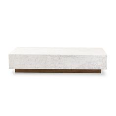 a white marble and wood coffee table