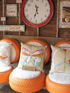 an assortment of orange and white furniture with clocks on the wall