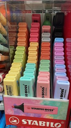 a display case filled with lots of different colored crayons