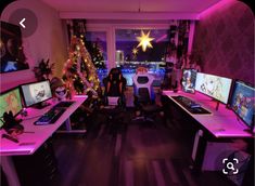 a room filled with computer monitors and desks