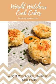 three crab cakes on top of a white and brown chevroned paper with the words weight watchers crab cakes