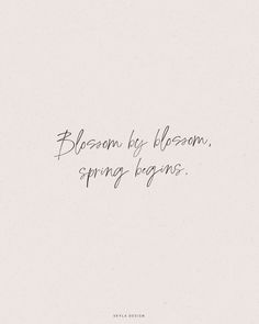 the words blossom by bloom, spring begins written in black ink on a white background