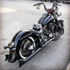 a black motorcycle is parked on the street