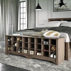 a bedroom with a large bed and lots of storage