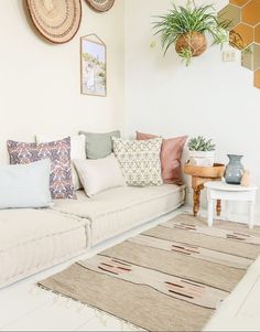 a living room filled with lots of pillows