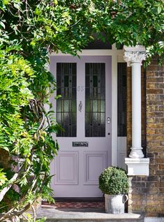 the front door to a house is painted lavender