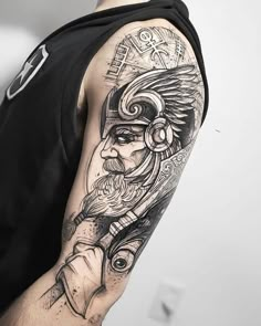 a man with a tattoo on his arm