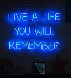 a neon sign that says live a life you will remember