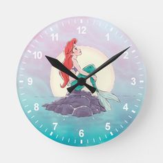 a clock with the image of ariel from the little mermaid on it