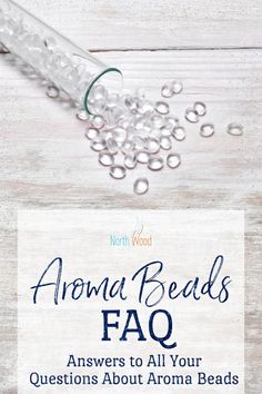 an ad for the aroma beads faq on a wooden table with water and soap bubbles