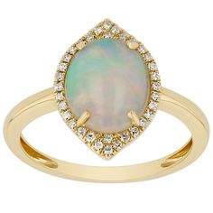 an opal and diamond ring in yellow gold