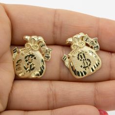 "3/4\" Diamond Cut Money Bag Stud Earrings Real Solid 10K Yellow Gold * Metal : Real Solid 10K Gold (Properly Stamped, 10K) * Condition : Brand New * Finish : Polished * Average Weight : 3.25 grams * Length : Just over 3/4\" = 21mm * Width : Just under 13/16\" = 20mm * Clasp/Bail : Push Back All of our items are brand new and are shipped with a gift box." Body Jewelry Diy, Gold Pendants For Men, Custom Gold Jewelry, Xoxo Jewelry, Dope Jewelry Accessories, Belly Button Piercing Jewelry, Earrings Real, Hello Kitty Jewelry, Gold Money