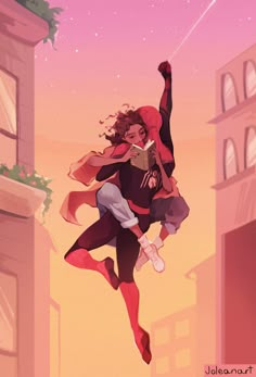 a woman flying through the air while holding onto a man's arm in front of buildings