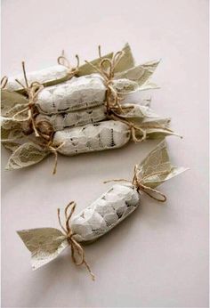 two white candy bags tied together with twine