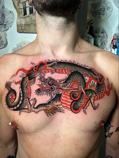 a man with a dragon tattoo on his chest