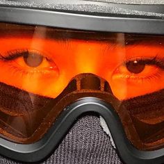 a close up of a person wearing a helmet and goggles