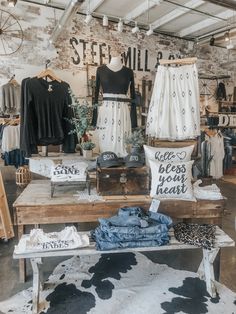 the interior of a clothing store with cow hide rugs and other items on display