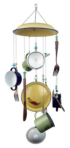 an assortment of kitchen utensils hanging from a ceiling fixture with spoons and forks attached to it