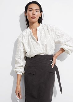 Voluminous blouse featuring a stand-up collar, floral appliqué detailing and long sleeves with gathered cuffs.• Loose silhouette• Curved hemline• Length of blouse:64.6cm / 25.4" (EU 36 / UK 10 / US 4) Applique Blouse, Summer Style Guide, Suit Jumpsuit, Floral Applique, Collar Blouse, Fashion Story, Short Jumpsuit, Swimwear Fashion, Style Guides