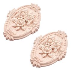 two white ceramic plates with flowers on them