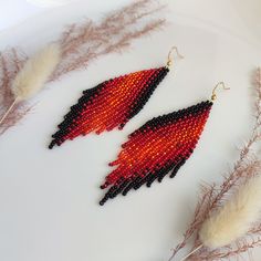 These long beaded earrings feature a black-and-red color scheme with a diagonal gradient. Handmade with meticulous attention to detail, they exude sophistication and elegance. Perfect for completing your ensemble with chic and style. Dimensions: - Length: 10 cm (3.9 inches) - Width: 3 cm (1.2 inches) Black And Red Pattern, Beaded Earrings Black, Long Beaded Earrings, Long Chandelier, Beaded Fringe Earrings, Red Color Schemes, Beaded Fringe, Red Pattern, Beading Tutorials