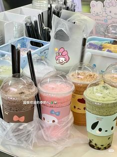 there are many different kinds of ice creams on the table in front of each other