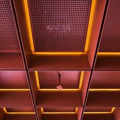 an instagram photo taken from the bottom of a room with red and yellow lighting