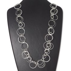 Versatile and artistic necklace brings eye-catching flair to your wardrobe or fashion displays. This silver-finished necklace features "pewter" (zinc-based alloy) and steel circles. Artistic Necklace, Fashion Displays, Everyday Jewelry, Lobster Claw, Gift Necklace, Circles, Brass, Chain, Wardrobe