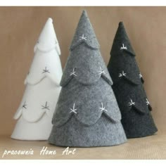 three small felt christmas trees in different colors