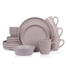 a set of grey dishes and cups with speckled designs on them, all in different sizes