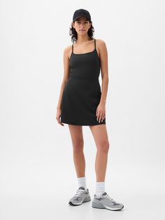 Soft brushed jersey exercise dress.  Moisture Wicking helps keep your skin dry.  Stretch allows freedom of movement while providing superior shape retention.  Square neck.  Adjustable spaghetti straps.  Built-in shorts.  This exercise dress is made with 79% recycled polyester.  Using recycled materials helps to conserve resources and reduce waste.  * Fit: Slim.  A fit & flare silhouette that sits close to the body & flares at the waist.  Hits above the knee.  Models wearing Gap Workout Dress Outfit, Athletic Dress Outfit, Exercise Fits, Capsule Style, Exercise Dress, Work Fits, Athleisure Dress, Mom Fashion, Athletic Dress