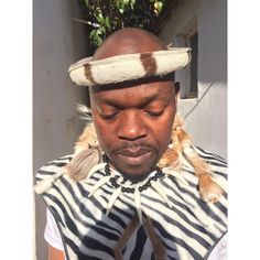 Immerse yourself in the rich heritage of the Zulu culture with our exquisite Zulu Mbata (warrior chestguard) made of cotton fabric with patterns of a zebra, Umgexo (Beaded necklace made of fake animal teeth)  and Umqhele (traditional headband) set made of real zebra skin and cow tail, meticulously handcrafted from genuine zebra skin, cow skin, beads and cotton fabrics. This stunning set is a true embodiment of Zulu craftsmanship and is perfect for collectors, cultural enthusiasts, or anyone looking to add a touch of African tradition to their space. Key Features: Authentic Craftsmanship: Each piece is handmade by skilled artisans from South Africa, ensuring authenticity and exceptional quality. Real Zebra Skin: The headband is made from genuine zebra and cowskin, this set offers a unique a White Habesha Kemis For Traditional Ceremonies, White Habesha Kemis For Ceremonial Festivals, White Habesha Kemis With Traditional Patterns For Ceremonies, Traditional White Habesha Kemis For Festival, Zulu Culture, Cow Tail, Shaka Zulu, Wedding Attire For Women, Zulu Warrior