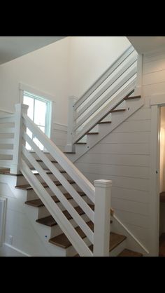 there is a white stair case in the house