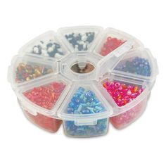 a plastic container filled with lots of different colored beads