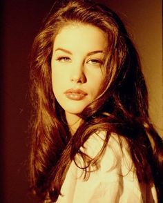 a black and white photo of a woman with long hair