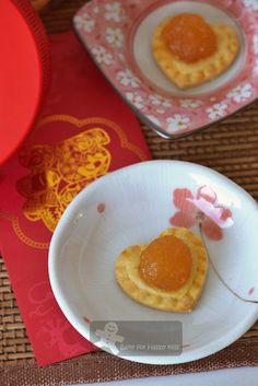 two small heart shaped pastries on a plate